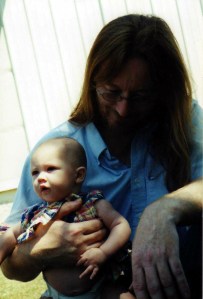 David's daughter, Abrie, held by Grandpa Corey.