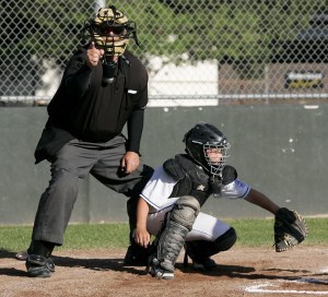 Kevin Dwelly calls a strike during a Little League game. Hank Schoeningh is the catcher. (Photo by Scott Manchester/Sonoma Press Democrat)