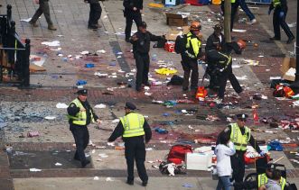 Police and emergency workers investigate after the April 15, 2013, bombing at the Boston Marathon that killed Martin Prince, Krystle Campbell and Lu Lingzi. Image from Wikipedia.