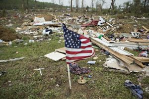 A flag flies amid the debris after the Vilonia tornado. Image by Wesley Hitt, Getty Images.