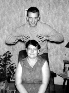 It looks like Daddy's getting ready to give Nanny a head massage.