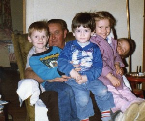 David, his brother Matt, and Sarah and her brother Derek sit on theirGrandpa.