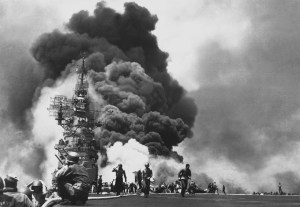  Flames leap from the deck of the USS Bunker Hill, after it was hit by two Kamikazes in 30 seconds on May 11, 1945 off Kyushu. 346 aboard were killed, another 264 wounded. (U.S. Navy) Image found on The Atlantic.