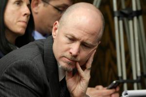 Greg Adams, now the former Little Rock School Board president listens during a hearing on the district's takeover by the state. Image by Danny Johnston, AP.