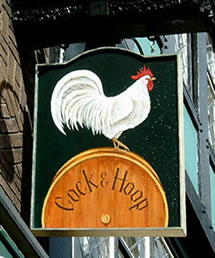 The Phrase Finder thinks the existence of several pub signs going back to at least the 14th Century, showing a chicken and a hoop, is the more likely origin. Image found on The Phrase Finder.