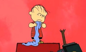 I think he's ready to open up a can of whoop-ass! Peanuts by Charles Schulz image found on Entertainment Weekly.